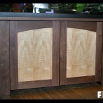Like the teak deck table, this walnut aquarium stand with tiger maple door panels is another furniture piece we built.