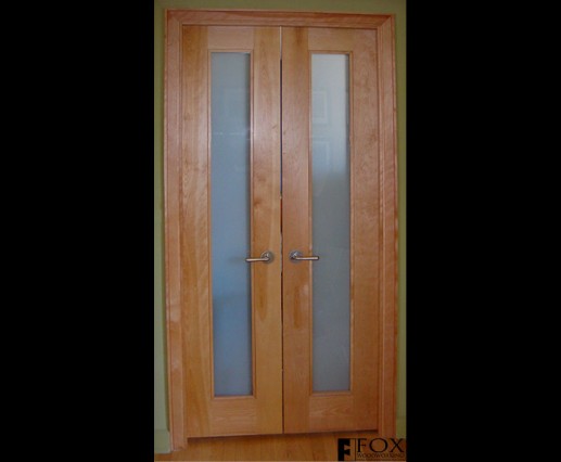 A pair of birch closet doors