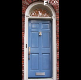 A blue painted six panel wood door.