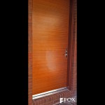 In addition to these painted red entry doors, we have also made a quarter sawn sapele veneer door.