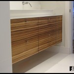 A zebrawood vanity cabinet with multiple drawers.