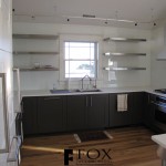 A great view of the floating stainless steel kitchen shelves and full height glass backsplash in Strathmere, NJ.