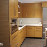 A view of the veneered teak kitchen cabinets.