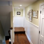 The painted beadboard wainscot in this hallway leads to the study alcove.