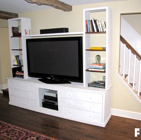 This entertainment center was painted with white milk paint for an aged look.