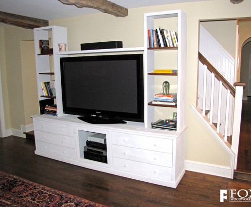 This entertainment center was painted with white milk paint for an aged look.