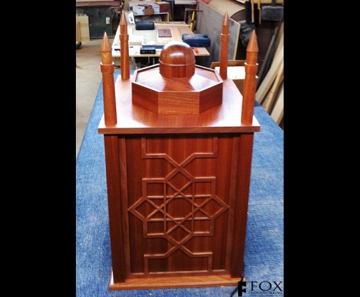Side view of a sapele Koran case showing the scrollwork.