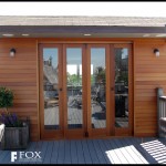 A set of mahogany patio doors and siding.