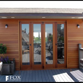 A set of mahogany patio doors and siding.