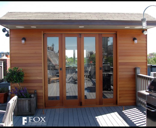 A set of mahogany patio doors and siding.