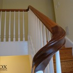 A hand-carved downsweeping sapele handrail